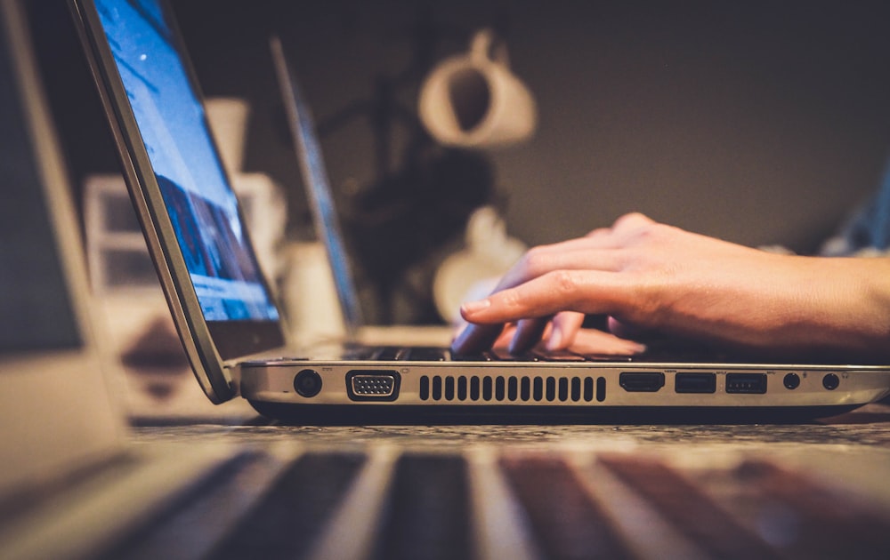 Person using a laptop for business reporting