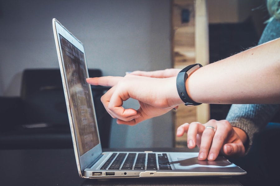 Person managing an e-commerce business on a laptop